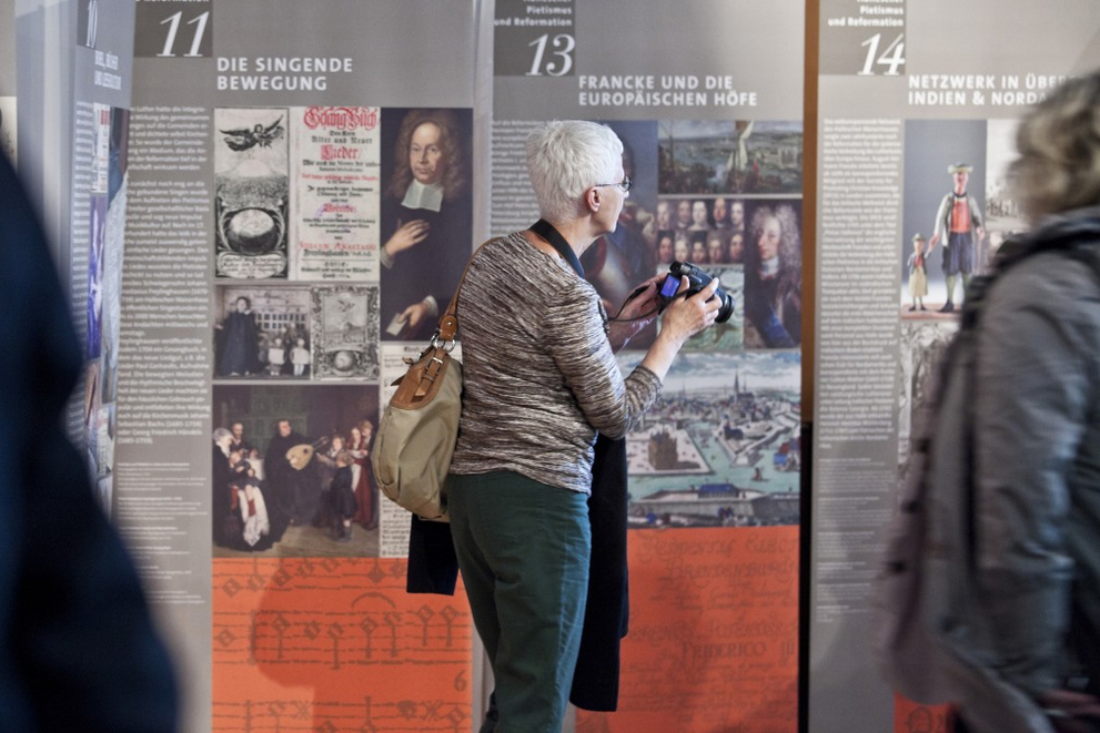 A woman visits the travelling exhibition Hallescher Pietismus und Reformation at the Representation of Saxony-Anhalt in Berlin.