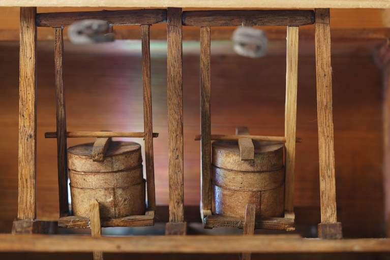 Detailed view of two wooden barrels of a model for school lessons from around 1700