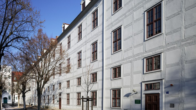 View of the half-timbered building of the former Boys' Orphanage and the new New Orphanage for Girls at Lindenhof Courtyard.